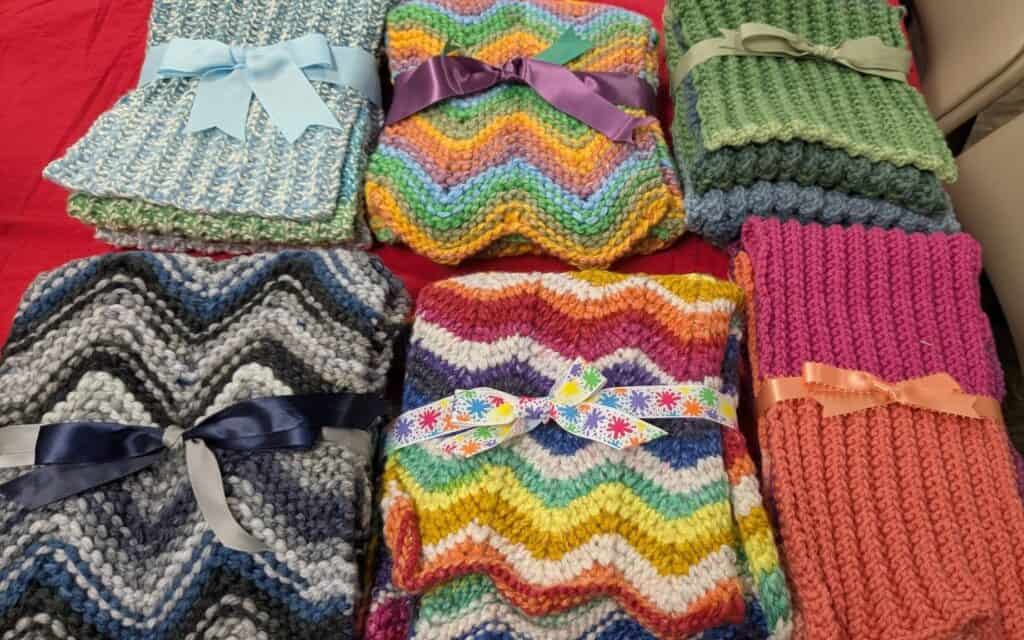 Threads of Compassion OKC - scarves tied with ribbon